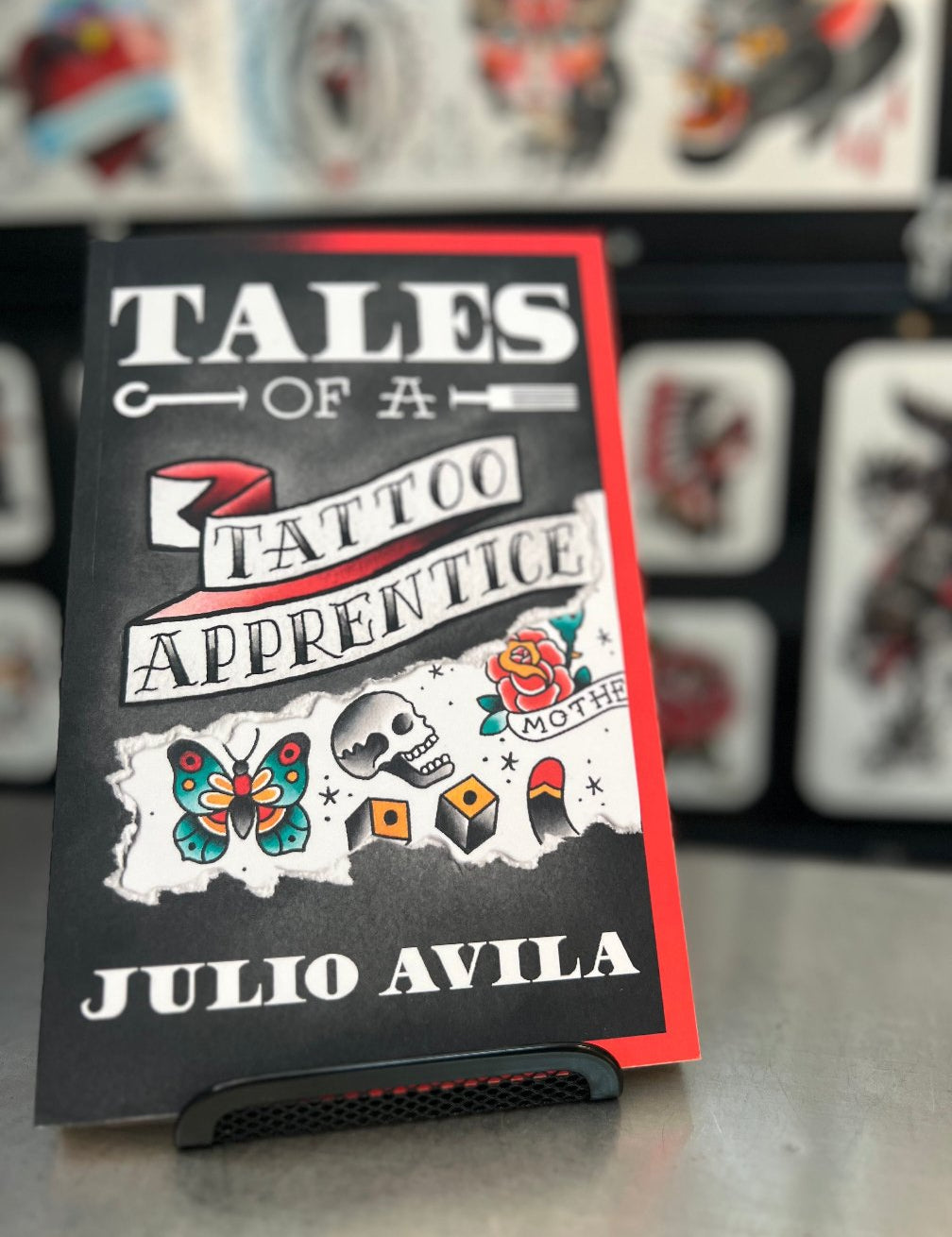 Tales of a Tattoo Apprentice book shown in Julios Tattoo Shop